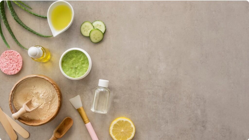 various natural ingredients like honey, oatmeal, lemon, cucumber, and herbs arranged aesthetically on a wooden surface